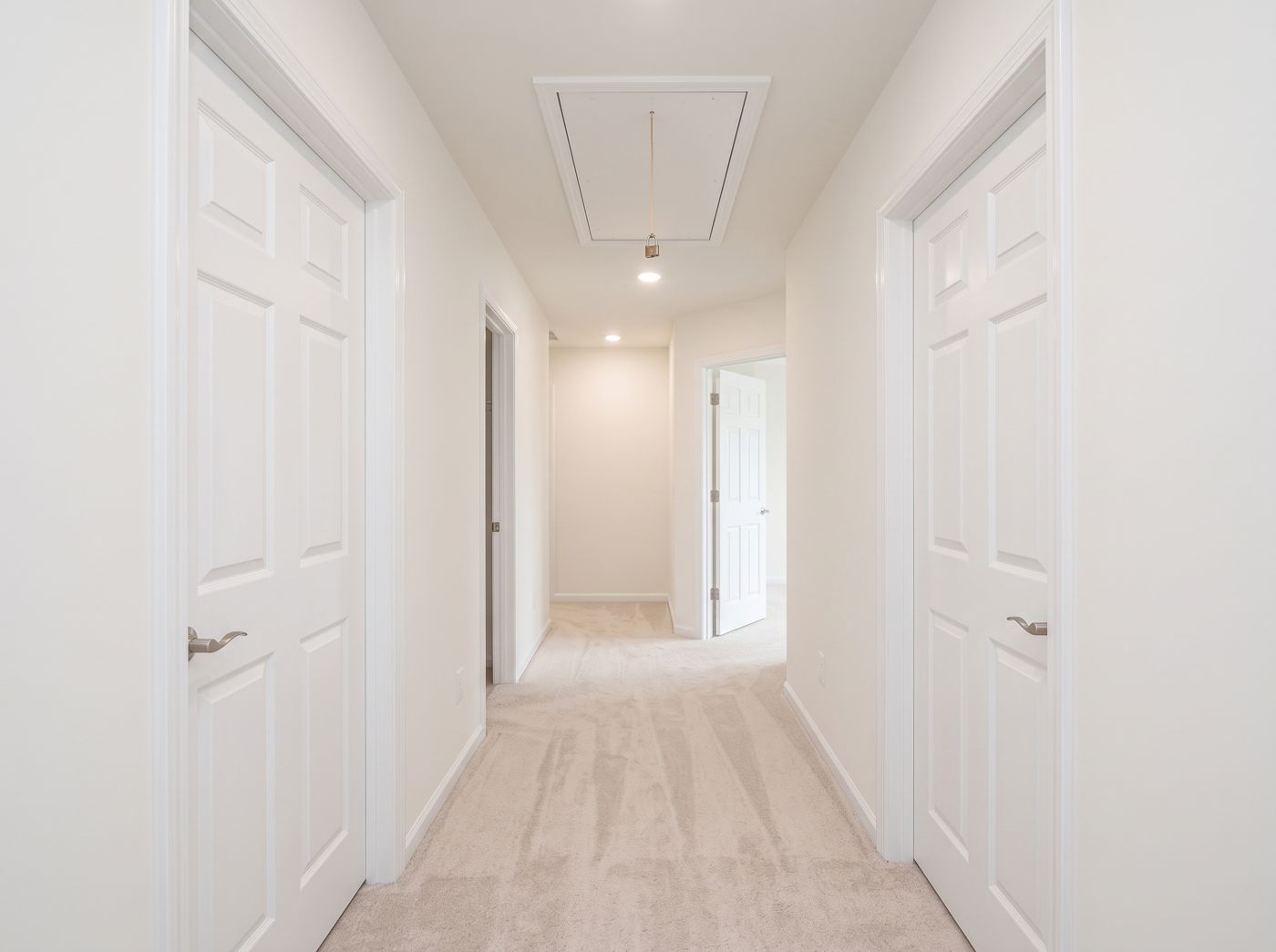 Upstairs hallway with attic access