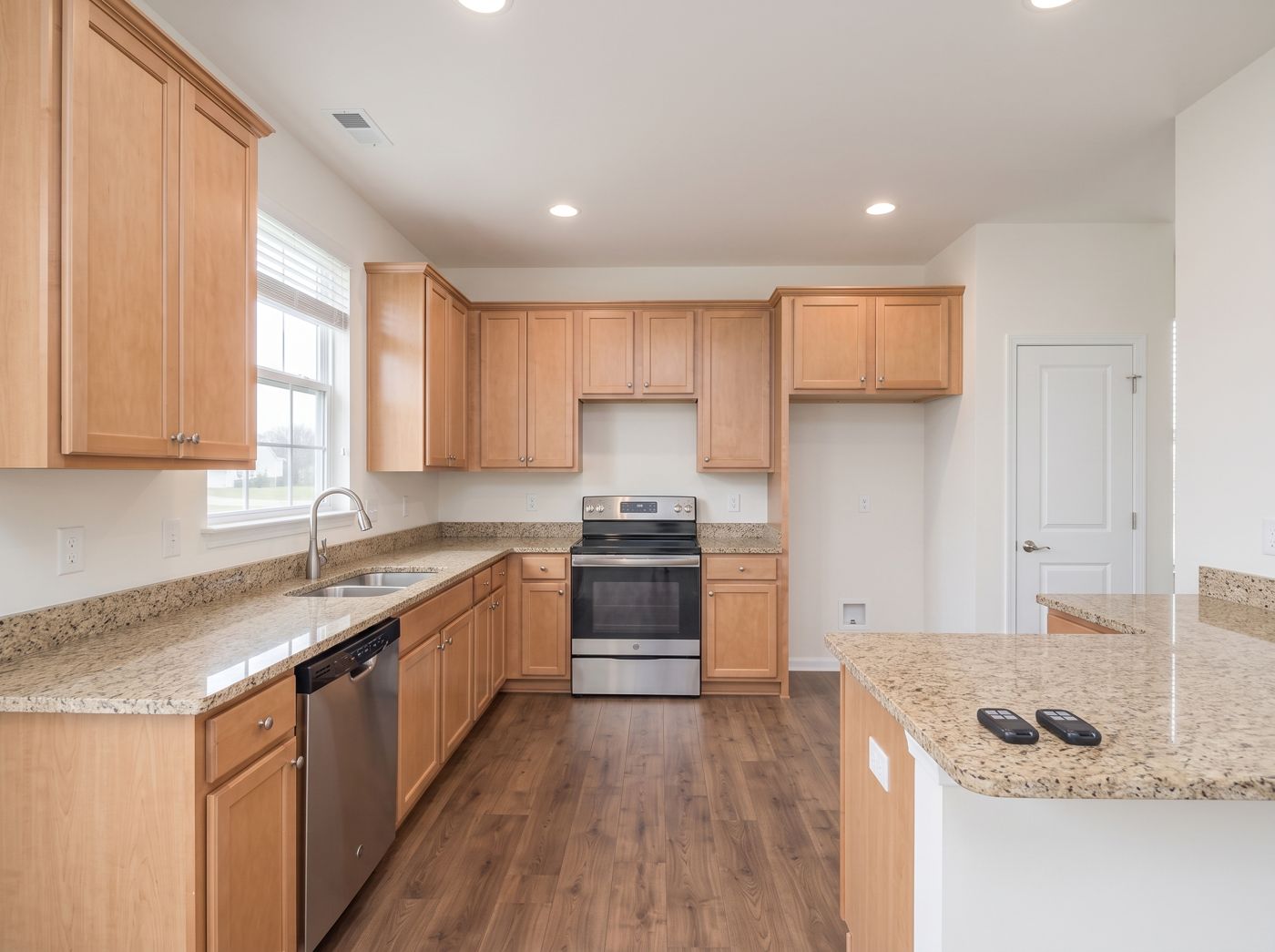 Kitchen with two garage remotes on the counter